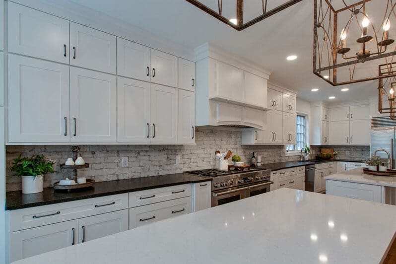 Open living and dining space remodeled by Reliant Construction Group